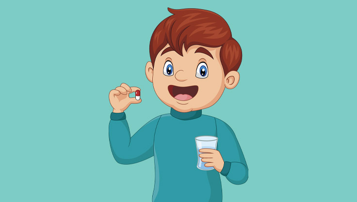 Dreng spiser vitaminpille